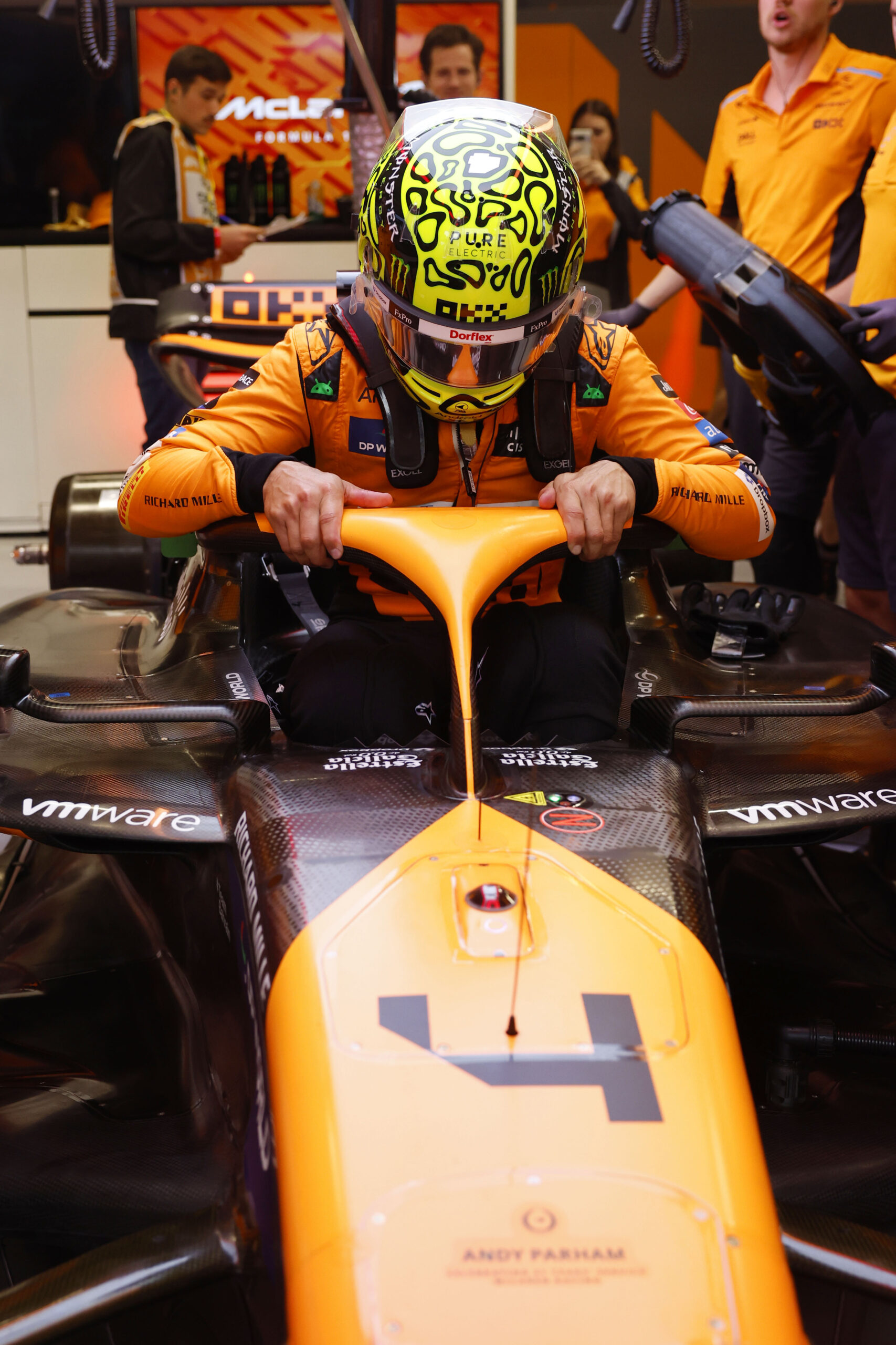 Lando Norris with his MCL38 inside the McLaren garage