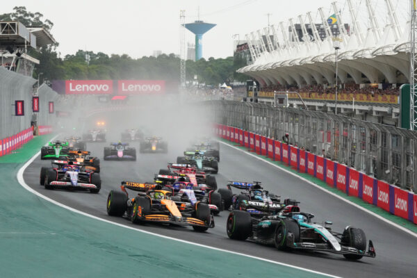 Lando Norris is passed by George Russell at the beginning of the 2024 Sao Paulo Grand Prix in Interlagos