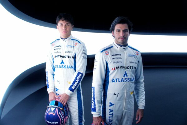 Williams Racing F1 agree multi-year deal with Atlassian. Carlos Sainz and Alex Albon pose for a photo.