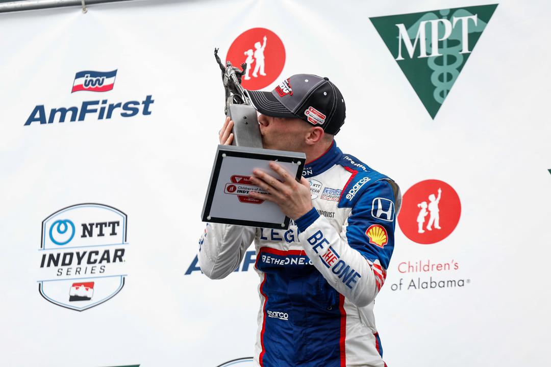 Linus Lundqvist on the podium with his trophy at Barber Motorsports Park