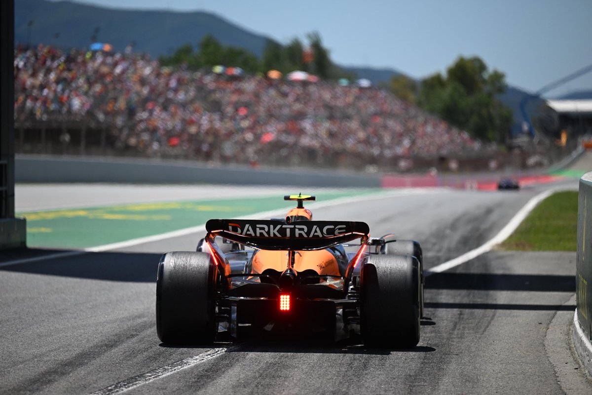 A McLaren waiting at the end of the pit lane in Spain