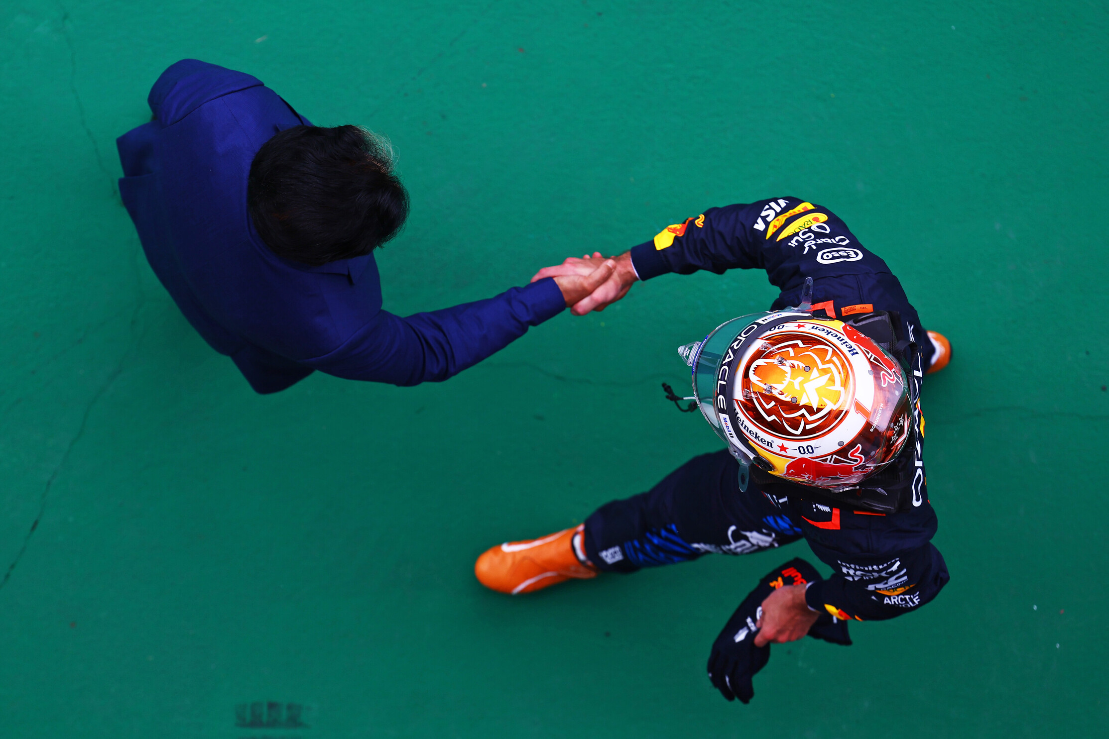 Max Verstappen talks with FIA President Mohammed Ben Sulayem in the pitlane during 2024 Hungarian GP qualifying