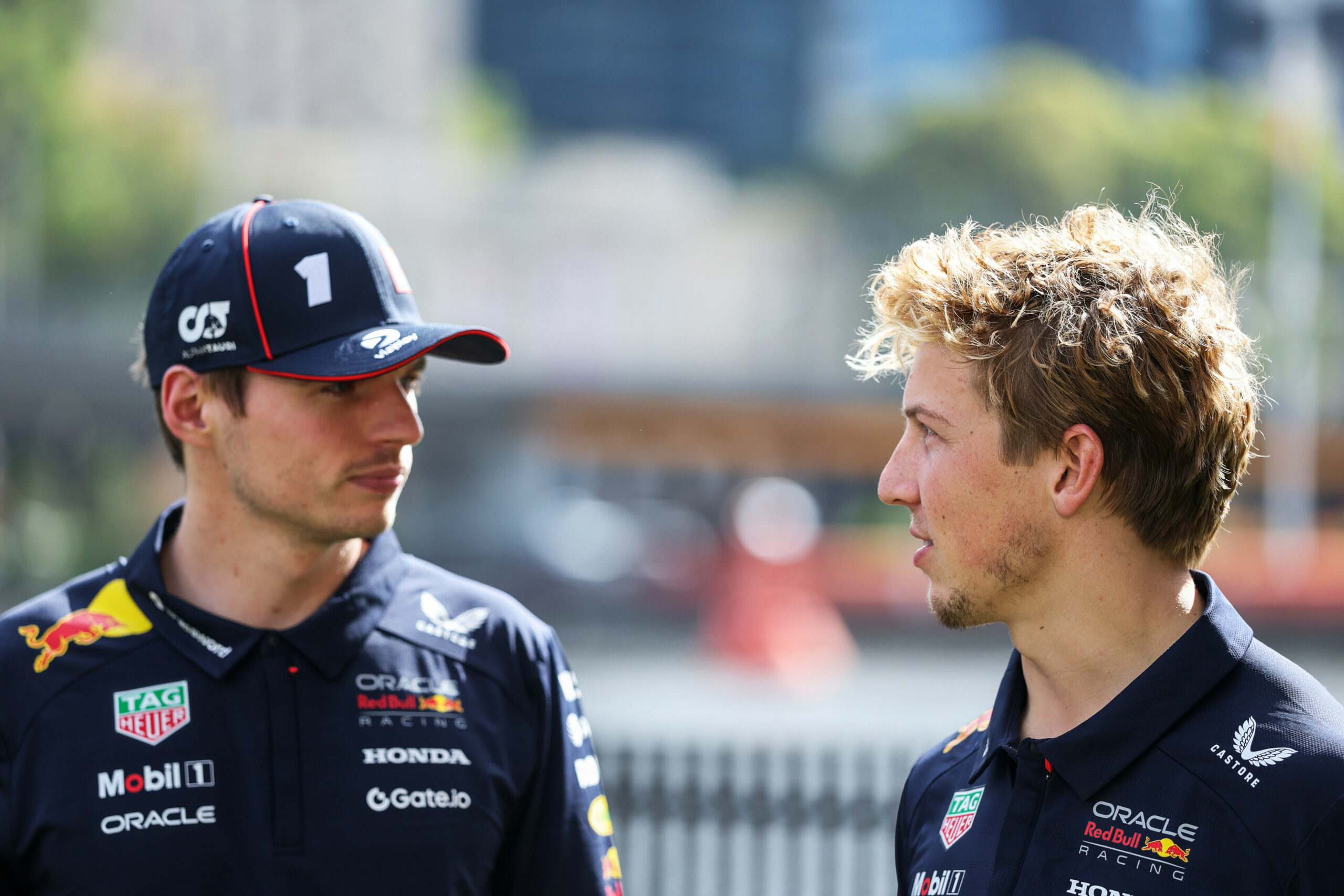 MELBOURNE, AUSTRALIA - MARCH 12: Max Verstappen of the Netherlands and Oracle Red Bull Racing and Liam Lawson of New Zealand and Oracle Red Bull Racing talk at an Oracle Red Bull Racing event during previews ahead of the F1 Grand Prix of Australia at Albert Park Grand Prix Circuit on March 12, 2025 in Melbourne, Australia. (Photo by Mark Thompson/Getty Images) // Getty Images / Red Bull Content Pool // SI202503120041 // Usage for editorial use only //