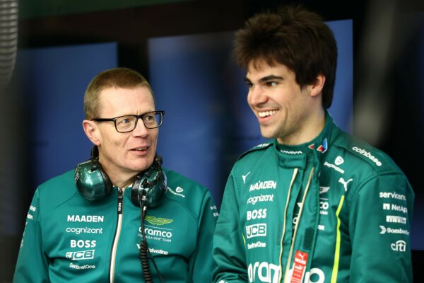 Andy Cowell, Team Principal and Group CEO at Aston Martin F1 Team, and Lance Stroll of Canada and Aston Martin F1 Team talk in the garage before the first race in Melbourne.