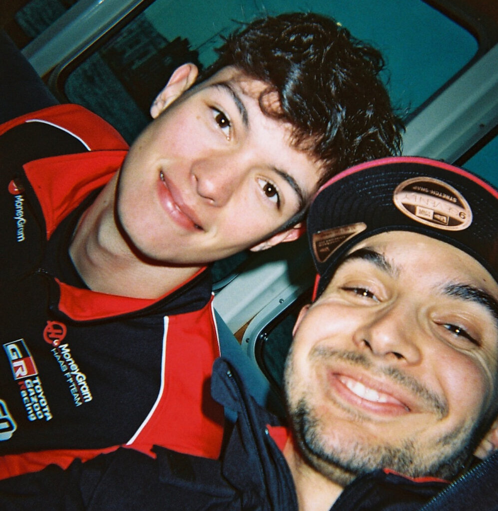 Closeup on Haas teammates Ollie Bearman and Esteban Ocon smiling