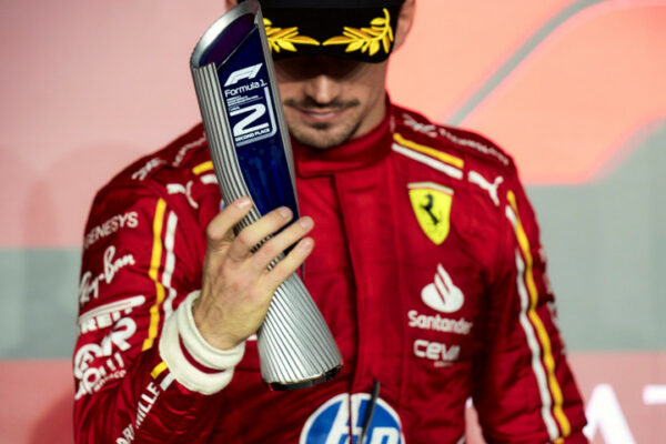 Charles Leclerc with his trophy on the podium after finishing P2 at the F1 Qatar GP