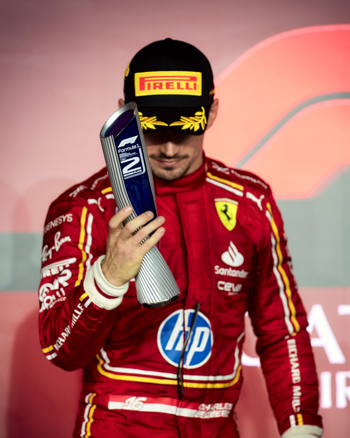 Charles Leclerc with his trophy on the podium after finishing P2 at the F1 Qatar GP